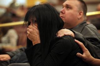 Rondha Gibson, the widow of Stanley Gibson, listens during the first Police Fatality Public Fact-finding Review concerning the Dec. 12, 2011 shooting of Stanley Gibson by a Metro Police officer at the Clark County Government Center in Las Vegas on Thursday, Feb. 28, 2013.