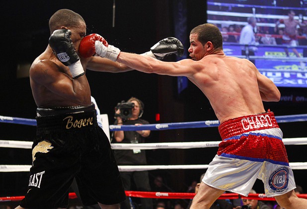 Richard Abril, right, of Cuba connects with a punch on Sharif Bogere of Uganda during their WBA lightweight title at the Hard Rock Hotel in Las Vegas, Nevada March 2, 2013. Abril retained his title with a unanimous decision victory.