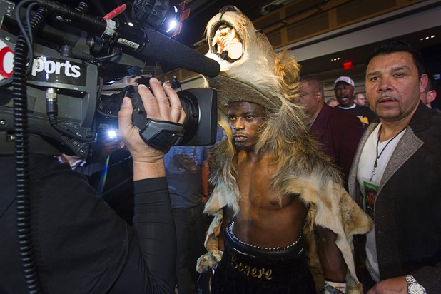Sharif "The Lion" Bogere of Uganda makes his ring walk wearing a lion skin for his title fight against WBA lightweight champion Richard Abril of Cuba at the Hard Rock Hotel in Las Vegas, Nevada March 2, 2013. Abril retained his title with a unanimous decision victory.