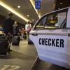 Travelers arriving at McCarran International Airport make their way through the taxi queue in Las Vegas on Friday, March 1, 2013. 
