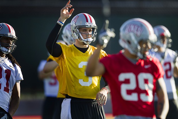 Quarterback Nick Sherry, center, exercises with the team during practice at Rebel Park at UNLV Monday, March 4, 2013.