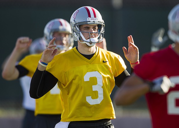 Quarterback Nick Sherry, center, exercises with the team during practice at Rebel Park at UNLV Monday, March 4, 2013.