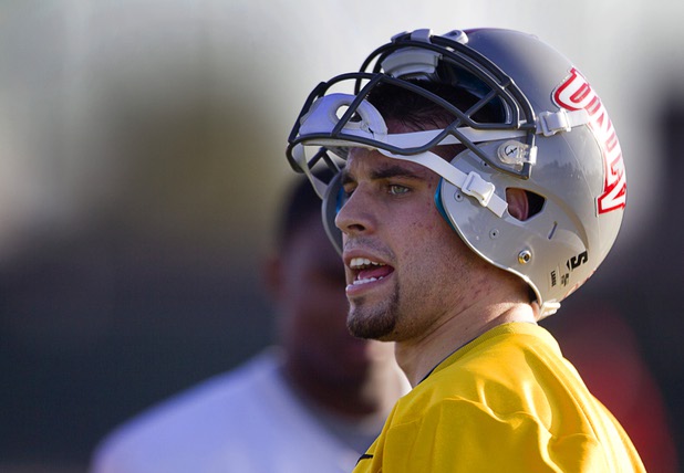 Quarterback Nick Sherry calls out to teammates during practice at Rebel Park at UNLV Monday, March 4, 2013.