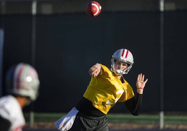 Quarterback Nick Sherry passes during practice at Rebel Park at UNLV Monday, March 4, 2013.