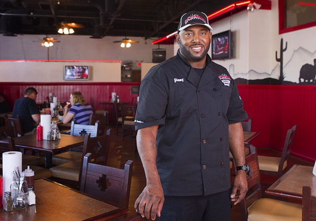 Chef and owner Jimmy Cole poses in the Top Notch Barbeque restaurant at Serene and Eastern avenues Tuesday, March 5, 2013. The restaurant is the same building but is separate from the Doc Holliday's tavern.