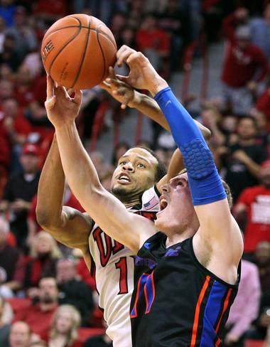 UNLV guard Bryce Dejean-Jones and Boise State guard Jeff Elorriaga fight for a rebound Tuesday, March 5, 2013 at the Thomas & Mack Center. UNLV won the game 68-64.