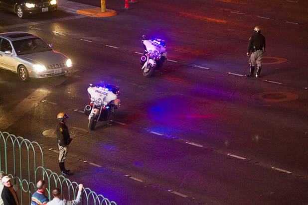 Police block westbound traffic on Harmon Avenue during a parade of NASCAR haulers on the Las Vegas Strip Wednesday, March 6, 2013.  The NASCAR hauler parade traveled north on the Las Vegas Strip to Sahara Avenue, then on I-15 to the Las Vegas Motor Speedway.