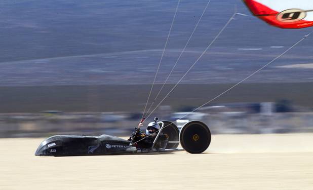 Brian Holgate, 28, runs in a specially-designed Peter Lynn kite buggy on the Ivanpah dry lake bed near Primm, Nev. Wednesday, March 6, 2013. Holgate set an unofficial kite buggy speed record of 84.4 mph at the lake bed in July 2012.