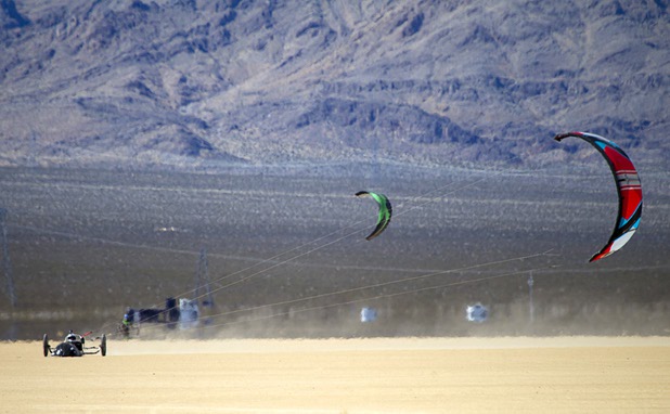 Brian Holgate, 28, runs in a specially-designed Peter Lynn kite buggy on the Ivanpah dry lake bed near Primm, Nev. Wednesday, March 6, 2013. Holgate set an unofficial kite buggy speed record of 84.4 mph at the lake bed in July 2012.