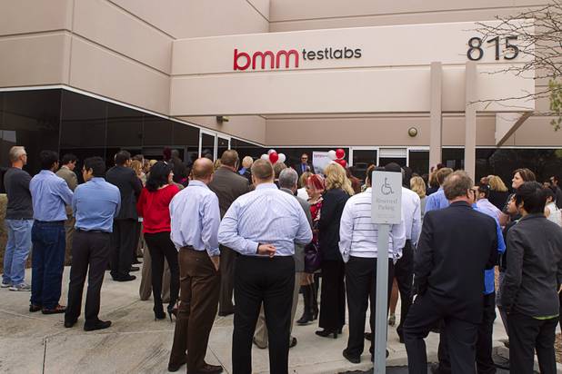 Employees and invited guests listen to speakers during the opening of the BMM Testlabs new world headquarters in Las Vegas Thursday, March 7, 2013. BMM employs more than 200 people in 12 countries and operates 11 gaming labs, serving more than 400 gaming jurisdictions.