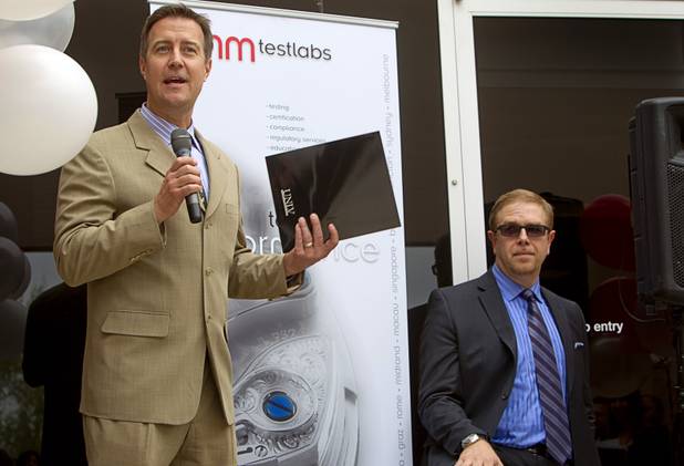 Bo J. Bernhard, executive director of UNLV's International Gaming Institute, speaks during the opening of the BMM Testlabs new world headquarters in Las Vegas Thursday, March 7, 2013. The company is giving two scholarships to UNLV gaming technology students. Mike Dreitzer, COO of BMM Americas, listens at right.