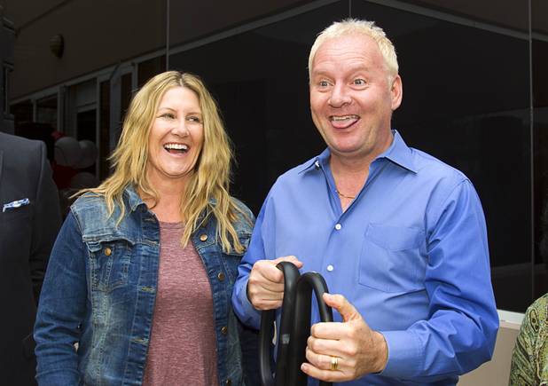 Martin Storm, BMM global president and CEO, and his wife Sandra react after cutting a ribbon during an opening ceremony for the BMM Testlabs new world headquarters in Las Vegas Thursday, March 7, 2013. BMM employs more than 200 people in 12 countries and operates 11 gaming labs, serving more than 400 gaming jurisdictions.