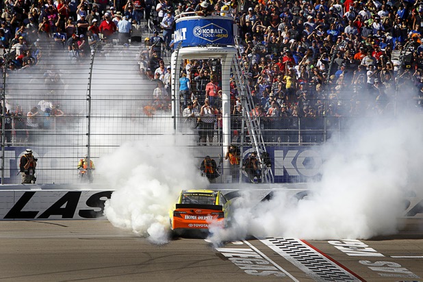 Matt Kenseth smokes his tires after winning the Kobalt Tools 400 at the Las Vegas Motor Speedway Sunday, March 10, 2013.