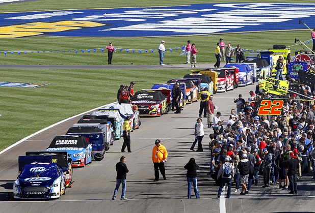 Fans get a close-up view of cars before the Kobalt Tools 400 NASCAR race at the Las Vegas Motor Speedway Sunday, March 10, 2013.