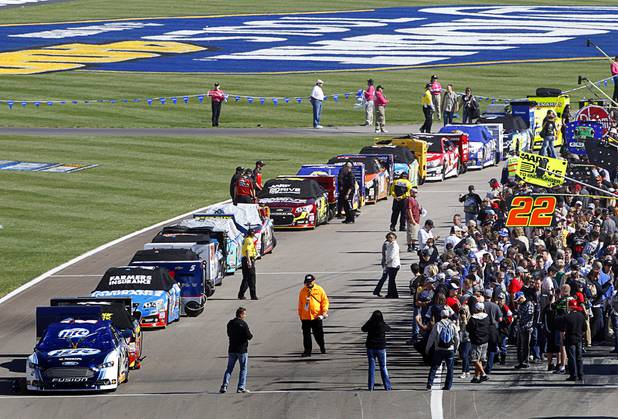Fans get a close-up view of cars before the Kobalt Tools 400 NASCAR race at the Las Vegas Motor Speedway Sunday, March 10, 2013.