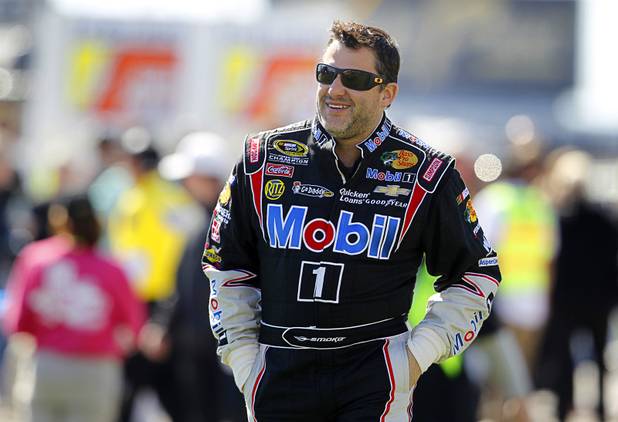 Driver Tony Stewart walks to driver introductions during the Kobalt Tools 400 NASCAR race at the Las Vegas Motor Speedway Sunday, March 10, 2013.