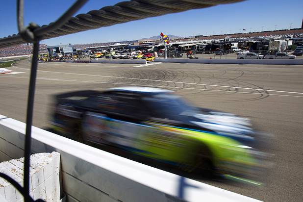 Carl Edwards (99) races during the Kobalt Tools 400 NASCAR race at the Las Vegas Motor Speedway Sunday, March 10, 2013.