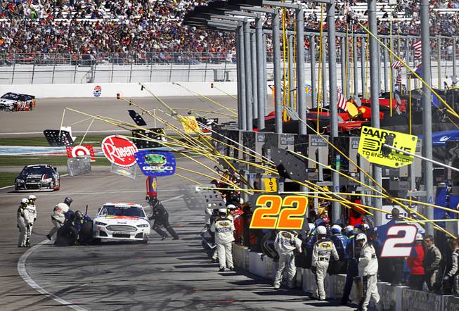 Ken Schrader (32) makes a pit stop during the Kobalt Tools 400 NASCAR race at the Las Vegas Motor Speedway Sunday, March 10, 2013.