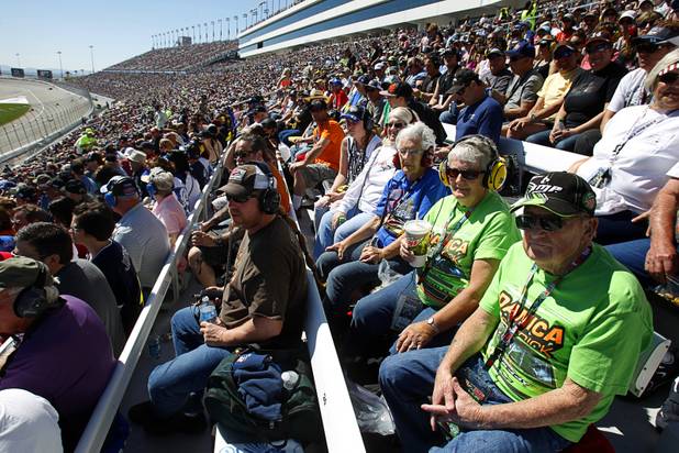 Race fans watch the Kobalt Tools 400 NASCAR race at the Las Vegas Motor Speedway Sunday, March 10, 2013.