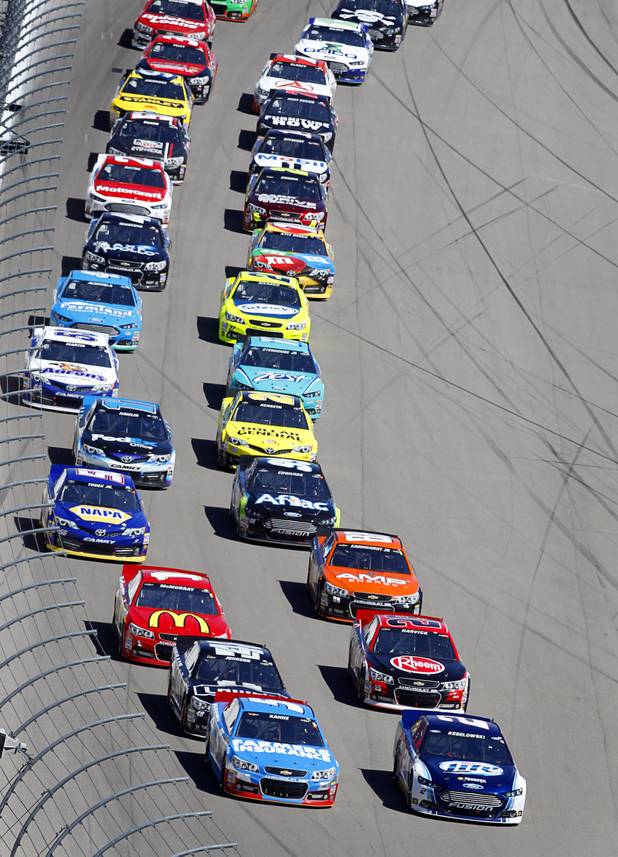 Drivers get a green flag after a caution during the Kobalt Tools 400 NASCAR race at the Las Vegas Motor Speedway Sunday, March 10, 2013.