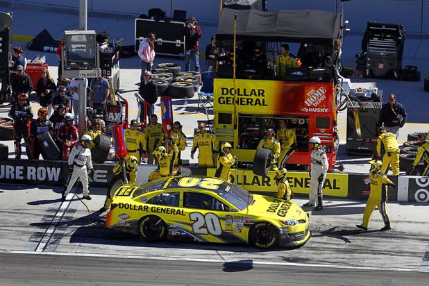 Matt Kenseth (20) makes a pit stop during the Kobalt Tools 400 NASCAR race at the Las Vegas Motor Speedway Sunday, March 10, 2013. Kenseth won the race.