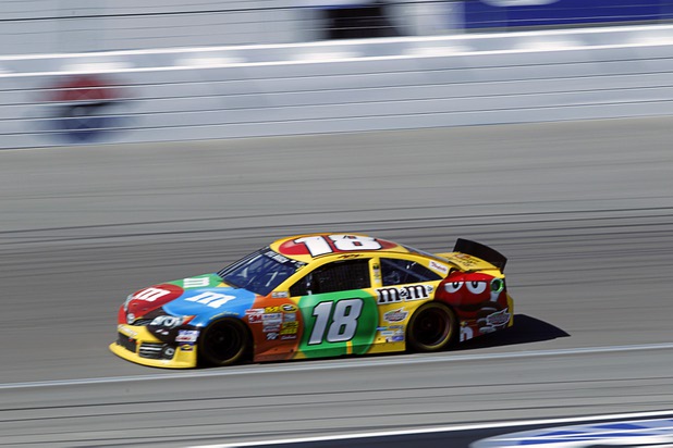 Las Vegan Kyle Busch (18) races during the Kobalt Tools 400 at the Las Vegas Motor Speedway Sunday, March 10, 2013.