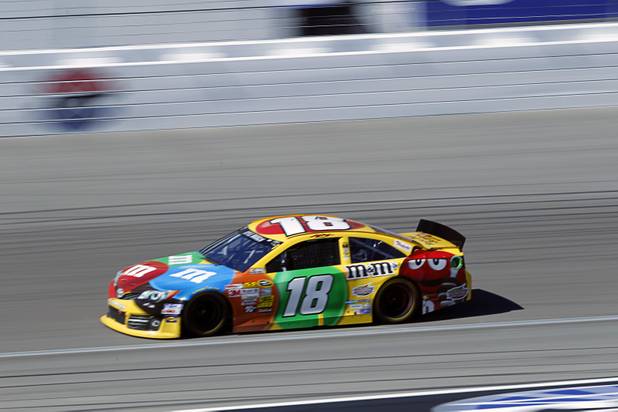 Las Vegan Kyle Busch (18) races during the Kobalt Tools 400 at the Las Vegas Motor Speedway Sunday, March 10, 2013.