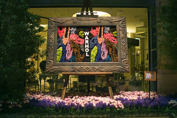 A florist version of artist Andy Warhol's "Diamond Dust Shoes (Random)" painting, made of flowers, is displayed the 2013 Spring exhibit at the Conservatory & Botanical Gardens in the Bellagio Monday, March 11, 2013.