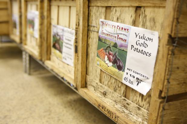 Crates of organic potatoes are shown at Trish & Ed's Organics, Wednesday, March 6, 2013.