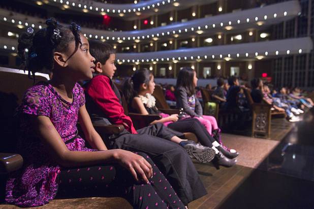 Second grader Sarah Julien, left, from Cahlan Elementary School, watches a performance of "The Stinky Cheese Man and other Fairly Stupid Tales" at the Smith Center for the Performing Arts Tuesday, March 12, 2013.  As part of the Smith Center's mission combining performing arts and education, and in partnership with the Clark County School District, the center hosted more than 1,500 elementary school students from Southern Nevada for the special performance by members of the Griffin Theater of Chicago.