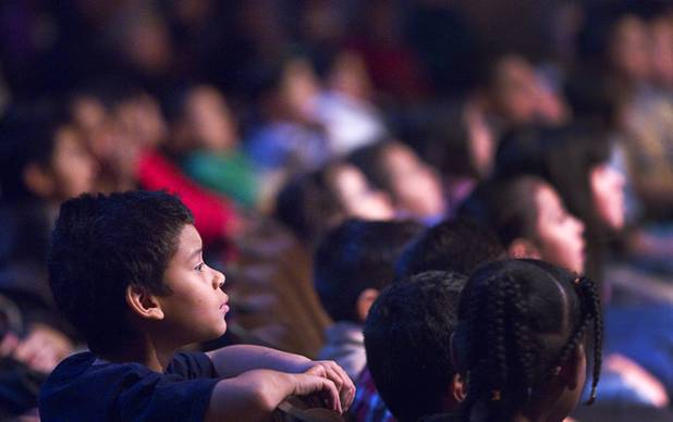 An elementary school student watches a performance of "The Stinky Cheese Man and other Fairly Stupid Tales" at the Smith Center for the Performing Arts Tuesday, March 12, 2013.  As part of the Smith Center's mission combining performing arts and education, and in partnership with the Clark County School District, the center hosted more than 1,500 elementary school students from Southern Nevada for the special performance by members of the Griffin Theater of Chicago.