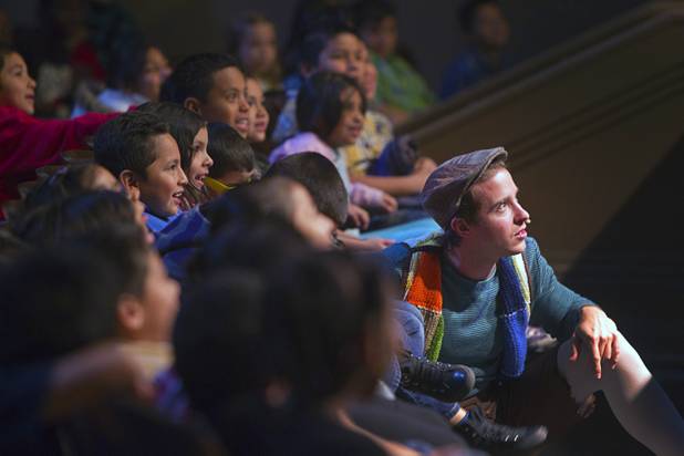 "Jack," right, played by Daniel Desmarais, hides from the giant in the audience during "The Stinky Cheese Man and other Fairly Stupid Tales" at the Smith Center for the Performing Arts Tuesday, March 12, 2013.  As part of the Smith Center's mission combining performing arts and education, and in partnership with the Clark County School District, the center hosted more than 1,500 elementary school students from Southern Nevada for the special performance by members of the Griffin Theater of Chicago.