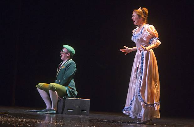 A princess, right, played by Kaitlyn Griggs, reacts after kissing a frog, played by David Mitchell, during "The Stinky Cheese Man and other Fairly Stupid Tales" at the Smith Center for the Performing Arts Tuesday, March 12, 2013. The frog initially told the princess that he was really a prince and a kiss would break the spell that kept him as a frog, but after the kiss, he told the princess that he had just been kidding.