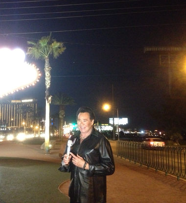 Wayne Newton appears at the Welcome to Fabulous Las Vegas sign on the evening of Monday, March 11, 2013, as part of the “American Idol” microphone tour.