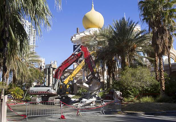 Workers demolish the old porte cochere at the SLS Las Vegas resort, formerly the Sahara, Wednesday, March 13, 2013. The renovated resort is expected to open in the fall of 2014.