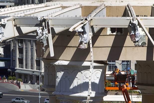Workers demolish the old porte cochere at the SLS Las Vegas resort, formerly the Sahara, Wednesday, March 13, 2013. The renovated resort is expected to open in the fall of 2014.