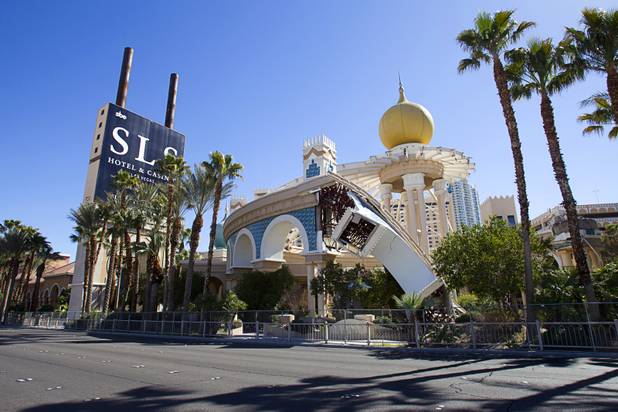 Workers demolish the old porte cochere at the SLS Las Vegas resort, formerly the Sahara, Wednesday, March 13, 2013. The renovated resort is expected to open in the fall of 2014.