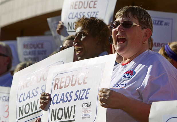 Clark County School District teachers cheer during a news conference outside the Sawyer State Building Wednesday, March 13, 2013. Teachers, parents and union members held the rally as legislators were meeting in a joint assembly and senate committee meeting to discuss education issues.