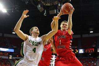 Fresno State guard Tyler Johnson grabs a rebound from Colorado State forward Pierce Hornung during their Mountain West Conference Tournament game Wednesday, March 13, 2013 at the Thomas & Mack.