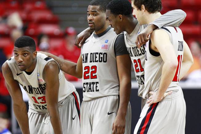 San Diego State teammates, from left, Winston Shepard, Chase Taplen, Jamaal Franklin and James Rahon huddle during a free throw attempt during their Mountain West Conference Tournament game against Boise State Wednesday, March 13, 2013 at the Thomas & Mack Center. SDSU won the game 73-67 and will face New Mexico on Friday.