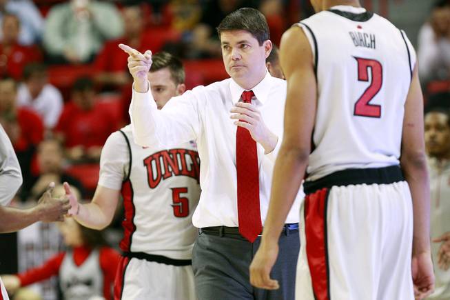 UNLV head coach Dave Rice points to one of his players during a timeout in their Mountain West Conference Tournament game against Air Force on Wednesday, March 13, 2013, at the Thomas & Mack. UNLV won 72-56.