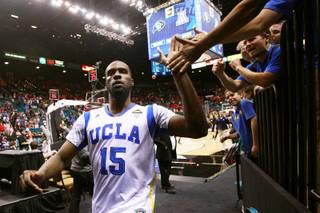 UCLA forward Shabazz Muhammad slaps hands with fans after the Bruins beat Arizona State 80-75 in their Pac-12 Basketball Tournament game Thursday, March 14, 2013 at the MGM Grand Garden Arena.