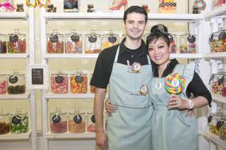 Victor and Arlene Bordinhao pose inside their candy shop, the B Sweet candy boutique at Tivoli Village, Thursday March 14, 2013.