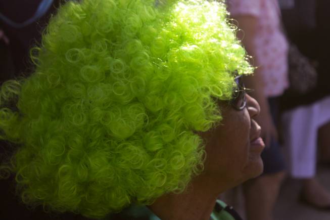 Francell Morgan wears her festive green wig during the St. Patrick's Day Parade in downtown Henderson, Saturday, Mar. 16, 2013.