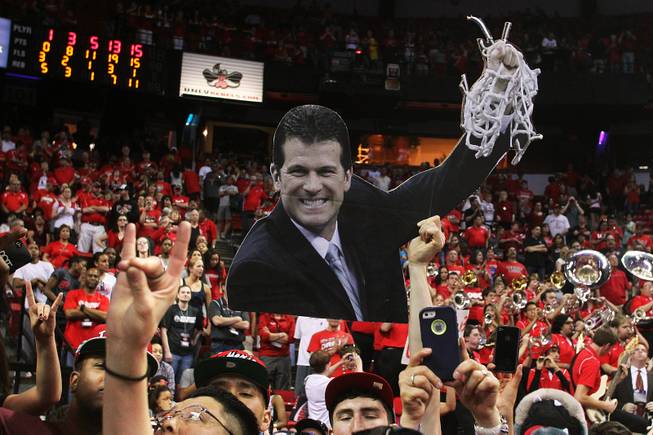 New Mexico fans hold up a cut out of coach Steve Alford after they defeated UNLV 63-56 in Mountain West Conference Tournament championship game Saturday, March 16, 2013 at the Thomas & Mack Center.