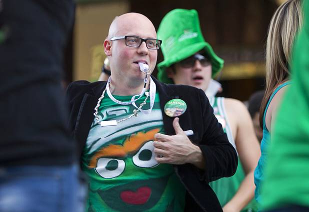 Partiers dance outside Hennessey's Tavern on Fremont Street during St. Patrick's Day Sunday, March 17, 2013.