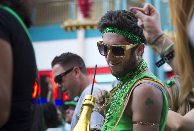 Partiers dance outside Hennessey's Tavern on Fremont Street during St. Patrick's Day Sunday, March 17, 2013.