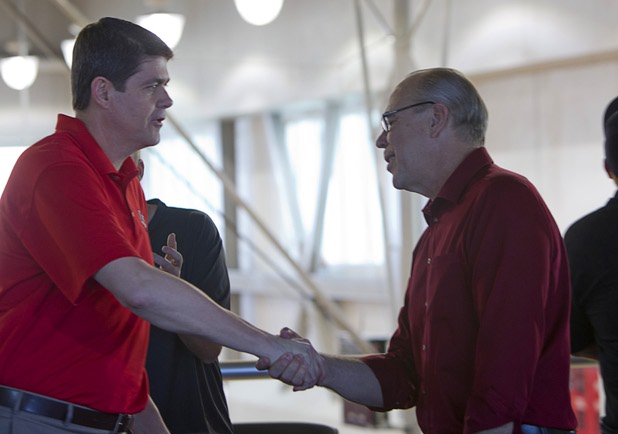 UNLV Runnin' Rebel head coach Dave Rice, left, shakes hands with UNLV President Neal Smatresk before watching the NCAA Tournament's Selection Show at the Mendenhall Center Sunday, March 17, 2013. UNLV will play Golden Bears in its NCAA tournament opener on Thursday at HP Pavilion in San Jose.