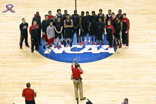 The UNLV basketball team has their photo taken by UNLV photographer R. Marsh Starks before practice for their second round NCAA Tournament game against Cal Wednesday, March 20, 2013 at the HP Pavilion in San Jose, Calif.