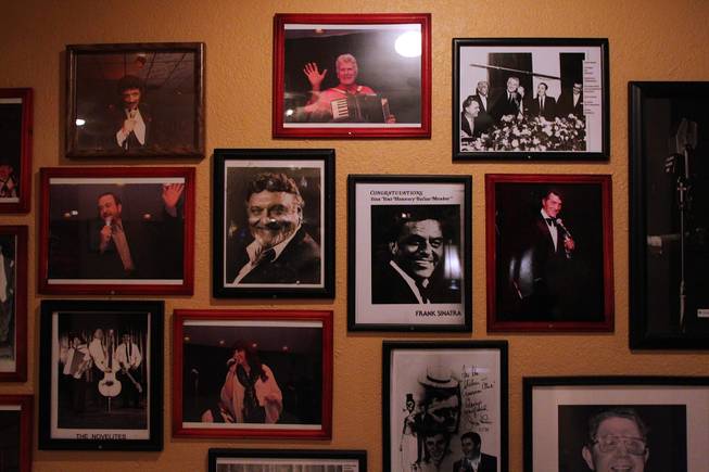 The "wall of fame" at the Italian American Social Club features musicians such as Dick Contino, Frank Sinatra and Dean Martin Saturday, March 23, 2013.